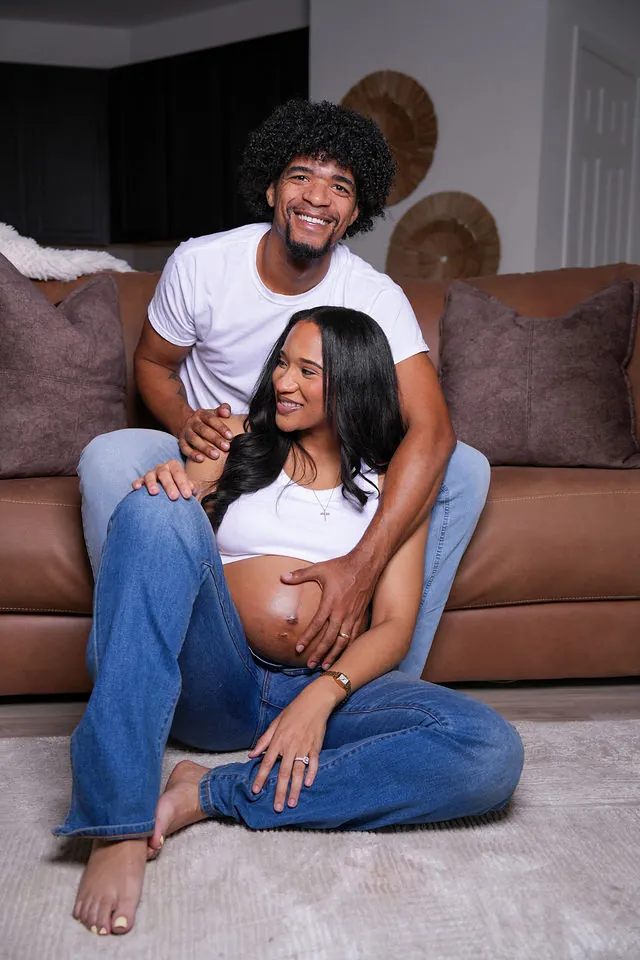 At-home maternity portrait of an expecting couple