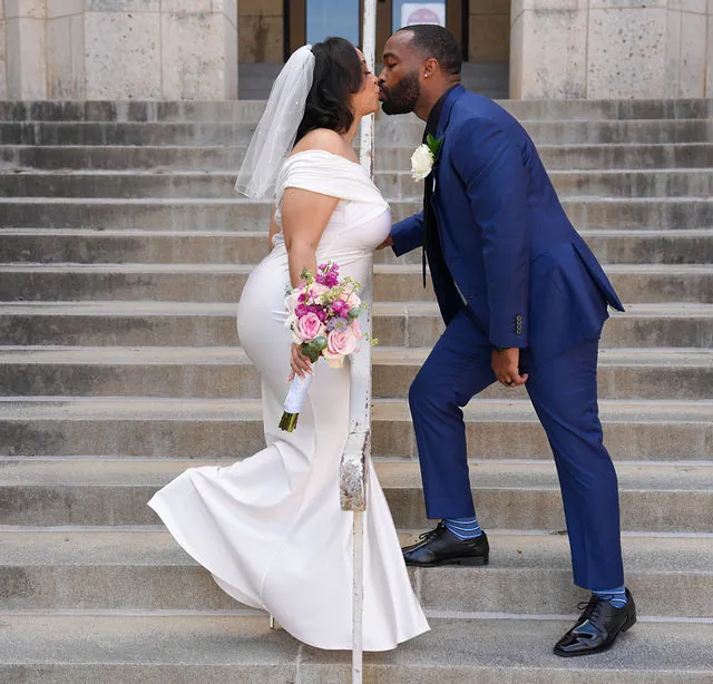 Newlyweds sharing a kiss on their wedding day